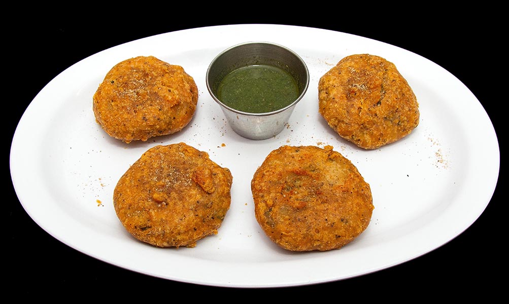 Crispy Aloo Chop potato fritters served with chutney at Indian Bites in Lyons, Boulder, Longmont, and Estes Park