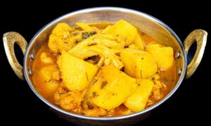 Aloo Gobi curry with tender potatoes and cauliflower simmered in spiced tomato gravy