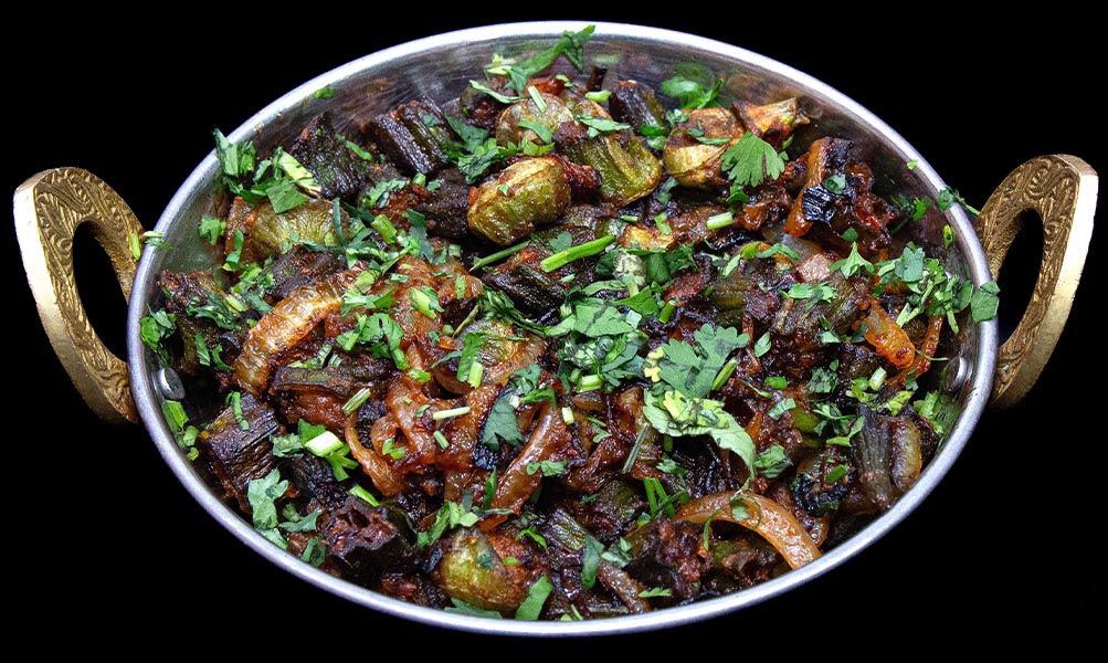 Spiced dry bhindi (okra) curry cooked with onions and tomatoes