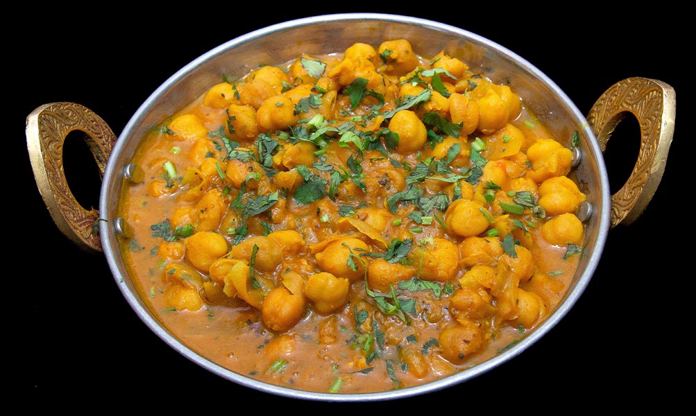 Spiced chana masala with chickpeas cooked in a tangy tomato and onion gravy