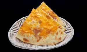 Cheese naan stuffed with melted cheese and baked to golden perfection