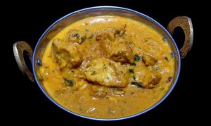 Sweet and tangy mango chicken curry with fresh mango chunks