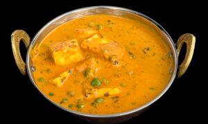 Soft paneer cubes and green peas cooked in spiced tomato gravy