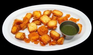 Crispy paneer pakora fritters served with chutney at Indian Bites in Lyons, Boulder, Longmont, and Estes Park