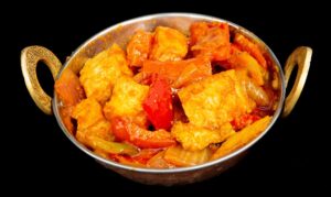 Spicy tofu chili stir-fry with bell peppers and onions