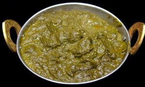 Tender potatoes cooked with creamy spinach and aromatic spices using coconut cream for a vegan and dairy-free option