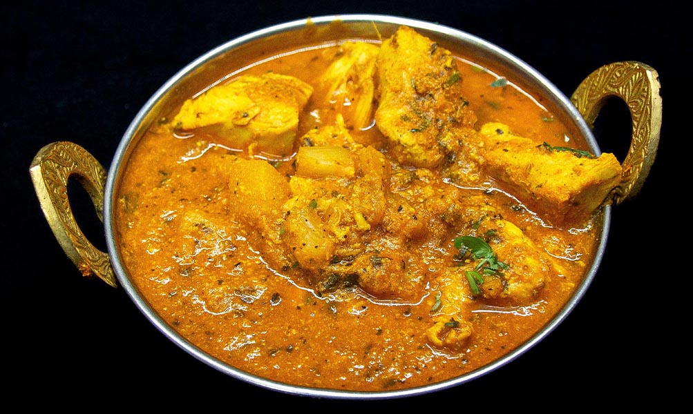 Traditional Indian chicken curry in spiced tomato and onion gravy