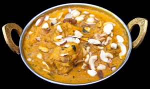Creamy Chicken Korma curry with cashews served hot at Indian Bites in Lyons, Boulder, and Estes Park