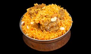Fragrant goat biryani with basmati rice, tender goat meat, and aromatic spices – Indian Bites in Lyons