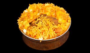 Assorted biryani dishes with fragrant basmati rice, spices, and meat or vegetables – Indian Bites