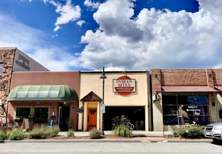 Front view of Indian Bites restaurant in Lyons, Colorado, featuring colorful storefront signage, inviting entrance, and authentic Indian dining atmosphere.