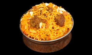 Fragrant lamb biryani with basmati rice, tender lamb pieces, and aromatic Indian spices – Indian Bites in Lyons