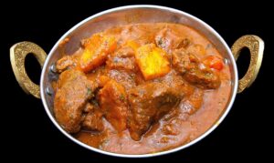Lamb curry in tangy vindaloo sauce with bold Indian spices – Indian Bites in Lyons