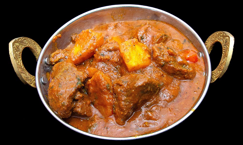 Lamb curry in tangy vindaloo sauce with bold Indian spices – Indian Bites in Lyons