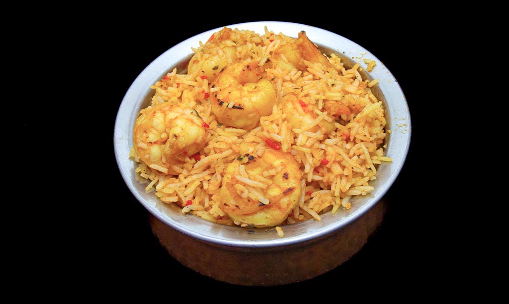 Fragrant shrimp biryani with basmati rice, succulent shrimp, and aromatic spices – Indian Bites in Lyons