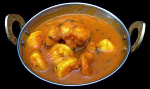 Shrimp and seafood cooked in a rich Indian tomato-onion curry