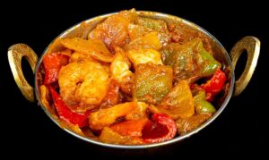 Juicy shrimp cooked in spicy tomato-based karahi sauce with peppers and onions – Indian Bites in Lyons
