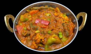 Mixed vegetables stir-fried in a tangy jalfrezi sauce with Indian spices – Indian Bites in Lyons