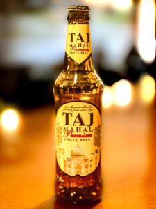 Bottle of Taj Mahal Beer, imported Indian lager served at Indian Bites Lyons Bar & Restaurant in downtown Lyons, Colorado